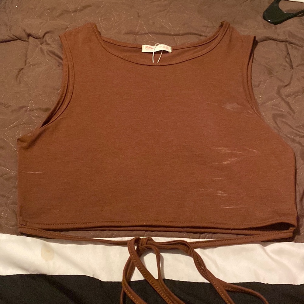 wrap around shirt, runs small (white stains are deodorant, i’ll clean it)